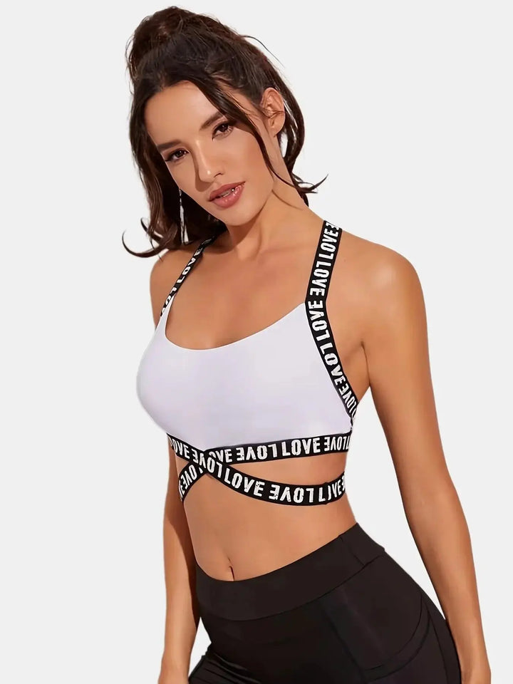 Woman modeling white sports bra with black &