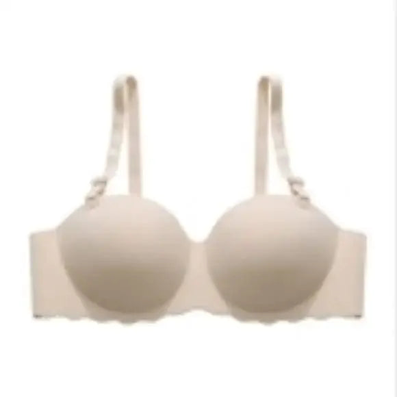 Seamless beige bra with adjustable straps on white background, OurLum.com health and beauty