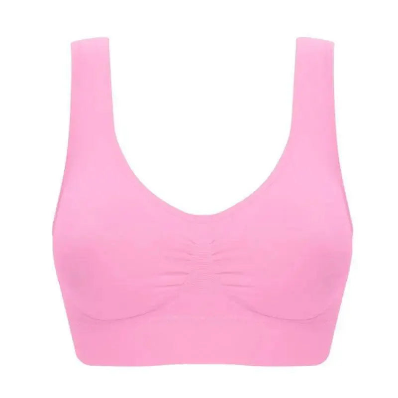 Seamless pink sports bra on white background, comfortable activewear from OurLum.com.